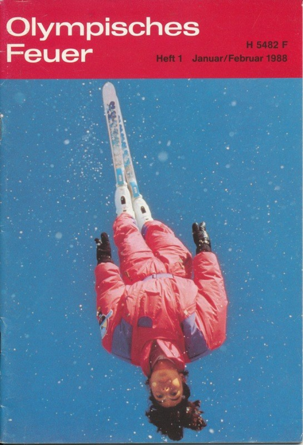 Titelbild eines Buches mit dem Titel "Olympische Spiele Feuer - Heft 1 - Januar/Februar 1988", das einen Skifahrer in der Luft zeigt.