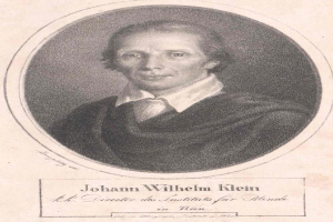 Schwarz-weißes Porträt von Johann Wilhelm Klein, Direktor des Instituts für Blinde in Wien, der einen weißen Hemdkragen trägt und ernst schaut, mit deutschem Text unten.