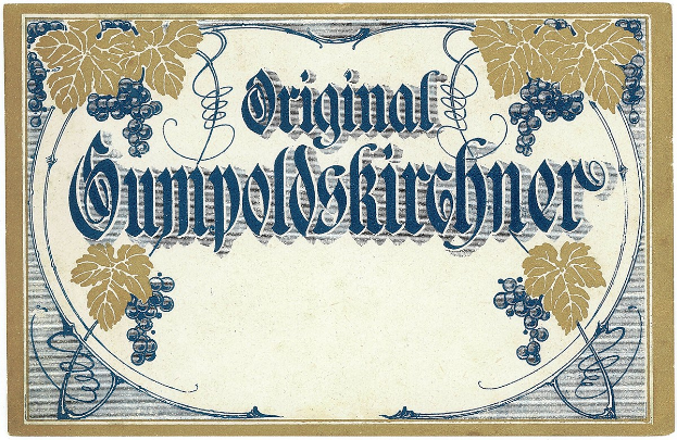 Alte deutsche Weinflasche mit Bild von Trauben und Blättern und Text, der den Wein Typ angibt.