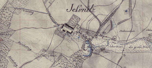 Ein detailliertes altes Stadtplan von Jelsnitz, Deutschland, mit einem zentralen Gebäude und umgebendem Text, das Straßen, Gebäude und andere Gebietselemente zeigt.